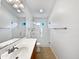 Bright bathroom with single vanity and glass enclosed shower featuring modern fixtures at 6255 S Opal Dr, Chandler, AZ 85249
