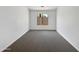Bedroom with neutral colored carpet and window featuring neighborhood views at 6255 S Opal Dr, Chandler, AZ 85249