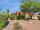 Charming home featuring a well-manicured yard, mature tree, and a two-car garage in a sunny neighborhood at 6255 S Opal Dr, Chandler, AZ 85249