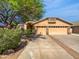 Charming home featuring a well-manicured yard, mature tree, and a two-car garage in a sunny neighborhood at 6255 S Opal Dr, Chandler, AZ 85249