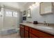 This bathroom features a dual sink vanity and a tub with shower at 6446 E Beverly Ln, Scottsdale, AZ 85254