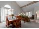Dining room open to the living room showcases vaulted ceilings, natural light and a chandelier at 6446 E Beverly Ln, Scottsdale, AZ 85254