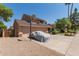Charming two-story home with a two-car garage and a driveway with covered car at 6446 E Beverly Ln, Scottsdale, AZ 85254