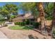 Inviting two-story home with lush landscaping, mature trees, and a well-maintained front yard at 6446 E Beverly Ln, Scottsdale, AZ 85254