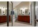 The main bathroom has a dual sink vanity with storage space, a shower, and a soaking tub at 6446 E Beverly Ln, Scottsdale, AZ 85254