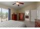 The main bedroom has neutral colors and is attached to the ensuite bathroom and spacious walk-in closet at 6446 E Beverly Ln, Scottsdale, AZ 85254