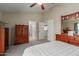 The main bedroom has neutral colors and is attached to the ensuite bathroom and spacious walk-in closet at 6446 E Beverly Ln, Scottsdale, AZ 85254