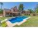 Backyard view of a private pool with diving board and outdoor seating area at 6446 E Beverly Ln, Scottsdale, AZ 85254