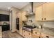 Well-equipped kitchen featuring granite countertops, stainless steel appliances, and ample cabinet space at 682 W Gum Tree Ave, Queen Creek, AZ 85140