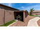 Outdoor pool equipment shed nestled in a well-kept backyard with stone pavers and desert landscaping at 682 W Gum Tree Ave, Queen Creek, AZ 85140