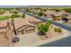 Lovely aerial view of the single-Gathering home with a well-maintained yard, multiple car garage, and desert landscaping at 6931 S Four Peaks Way, Chandler, AZ 85249