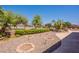 Inviting backyard with a built-in grill, custom landscaping, and decorative accents at 6931 S Four Peaks Way, Chandler, AZ 85249