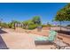 Comfortable backyard patio featuring a stainless steel grill and a cushioned lounge chair at 6931 S Four Peaks Way, Chandler, AZ 85249