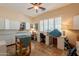 Bright craft room with tiled floors, ample counter space, storage, and natural light from large window at 6931 S Four Peaks Way, Chandler, AZ 85249