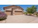 Charming single Gathering home with a three car garage and desert landscaping at 6931 S Four Peaks Way, Chandler, AZ 85249