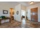 Welcoming foyer showcasing tile flooring, an elegant front door, and a view into the office at 6931 S Four Peaks Way, Chandler, AZ 85249