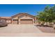 Charming single-story home showing a large three-car garage, desert landscaping, and spacious driveway at 6931 S Four Peaks Way, Chandler, AZ 85249