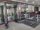 Gym with modern weight training equipment and mirrored walls at 6931 S Four Peaks Way, Chandler, AZ 85249