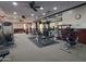 Well-equipped gym features weight machines, free weights, and mirrored walls at 6931 S Four Peaks Way, Chandler, AZ 85249