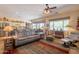 Comfortable living room featuring large windows and an open floor plan to the kitchen at 6931 S Four Peaks Way, Chandler, AZ 85249