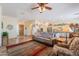 Spacious living room with tile flooring and open access to the kitchen and dining area at 6931 S Four Peaks Way, Chandler, AZ 85249