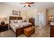 Comfortable main bedroom features ceiling fan, and plenty of natural light at 6931 S Four Peaks Way, Chandler, AZ 85249