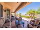 Spacious covered patio with lounge furniture and scenic backyard views at 6931 S Four Peaks Way, Chandler, AZ 85249