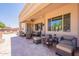Expansive covered patio featuring multiple seating areas for outdoor enjoyment at 6931 S Four Peaks Way, Chandler, AZ 85249