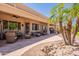 Landscaped backyard featuring a covered patio with inviting outdoor seating at 6931 S Four Peaks Way, Chandler, AZ 85249