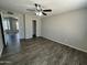 Comfortable bedroom with modern flooring, a ceiling fan, and a serene neutral color palette at 808 N 67Th Ln, Phoenix, AZ 85043