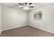 Bedroom with carpeted floors, a window with blinds, fan and neutral paint at 822 E Agua Fria Ln, Avondale, AZ 85323