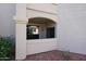 Cozy balcony featuring a stucco exterior with desert landscaping and a view of surrounding greenery at 9151 W Greenway Rd # 162, Peoria, AZ 85381