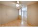 Simple bedroom with ceiling fan, wood floors and entry-way niche at 9151 W Greenway Rd # 162, Peoria, AZ 85381