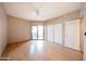 Bedroom featuring sliding glass doors, closet and ceiling fan at 9151 W Greenway Rd # 162, Peoria, AZ 85381