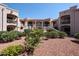 Lovely desert landscaping complements this building's elevated walkways with an orange patio umbrella in the background at 9151 W Greenway Rd # 162, Peoria, AZ 85381