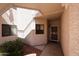 Inviting covered entry to unit 162 with shade and desert landscaping at 9151 W Greenway Rd # 162, Peoria, AZ 85381