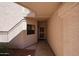 The shady entry to this unit features desert landscaping and the front door at 9151 W Greenway Rd # 162, Peoria, AZ 85381
