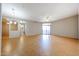 Spacious living room with a ceiling fan, laminate flooring, and sliding glass doors at 9151 W Greenway Rd # 162, Peoria, AZ 85381