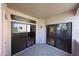 A covered patio featuring tiled flooring and sliding glass doors with a glimpse of the bathroom inside at 9151 W Greenway Rd # 162, Peoria, AZ 85381