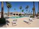 Community pool with plenty of lounge chairs, perfect for swimming and enjoying the sun at 9151 W Greenway Rd # 162, Peoria, AZ 85381