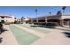 Community shuffleboard court with lush landscaping, providing a fun and social outdoor activity at 9151 W Greenway Rd # 162, Peoria, AZ 85381
