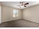 Cozy bedroom with natural light and plush carpeting at 917 E Agua Fria Ln, Avondale, AZ 85323