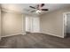 Large living room area with neutral paint and plush carpeting at 917 E Agua Fria Ln, Avondale, AZ 85323