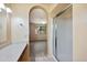 Bright bathroom with a glass-enclosed shower and light-filled vanity area with an archway to the bedroom at 9313 W Morrow Dr, Peoria, AZ 85382