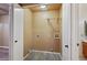 Walk-in closet with tile flooring, a shelf, and connections, offering convenient storage space at 9313 W Morrow Dr, Peoria, AZ 85382