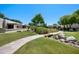 Well-maintained community grounds featuring lush landscaping, a bridge, and walking paths at 9313 W Morrow Dr, Peoria, AZ 85382