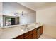 Bright kitchen featuring stainless sink, white countertops, and views of the outdoor patio at 9313 W Morrow Dr, Peoria, AZ 85382