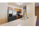 Cozy kitchen with stainless steel appliances and light wood cabinets, creating a warm and inviting atmosphere at 9313 W Morrow Dr, Peoria, AZ 85382