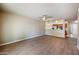 Expansive living room boasting stylish wood-look floors, fan and ample space for furniture at 9313 W Morrow Dr, Peoria, AZ 85382