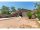 Backyard features dirt landscaping and exterior views of the home at 10009 W Raymond St, Tolleson, AZ 85353